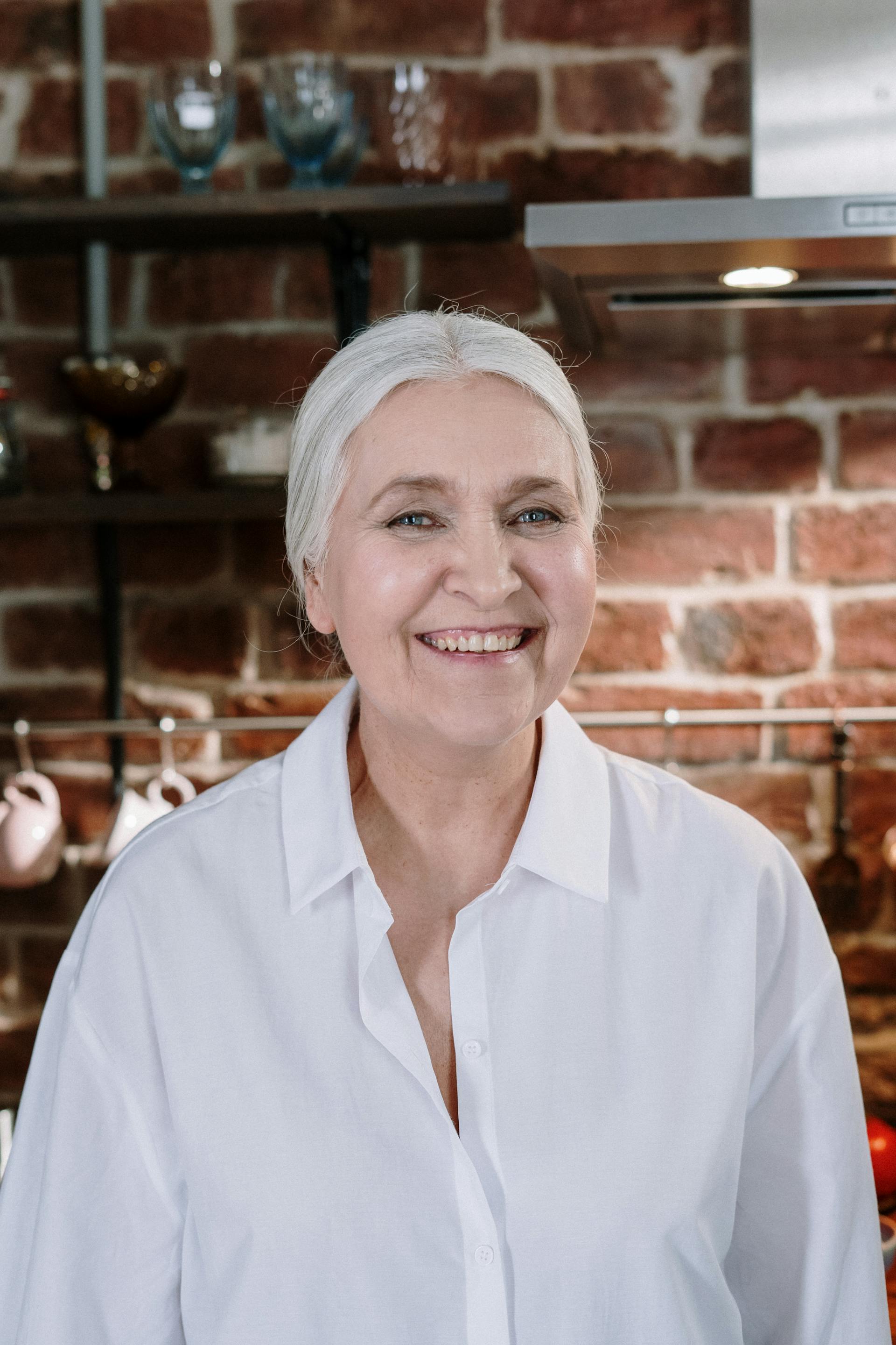 A smiling senior woman in the kitchen | Source: Pexels