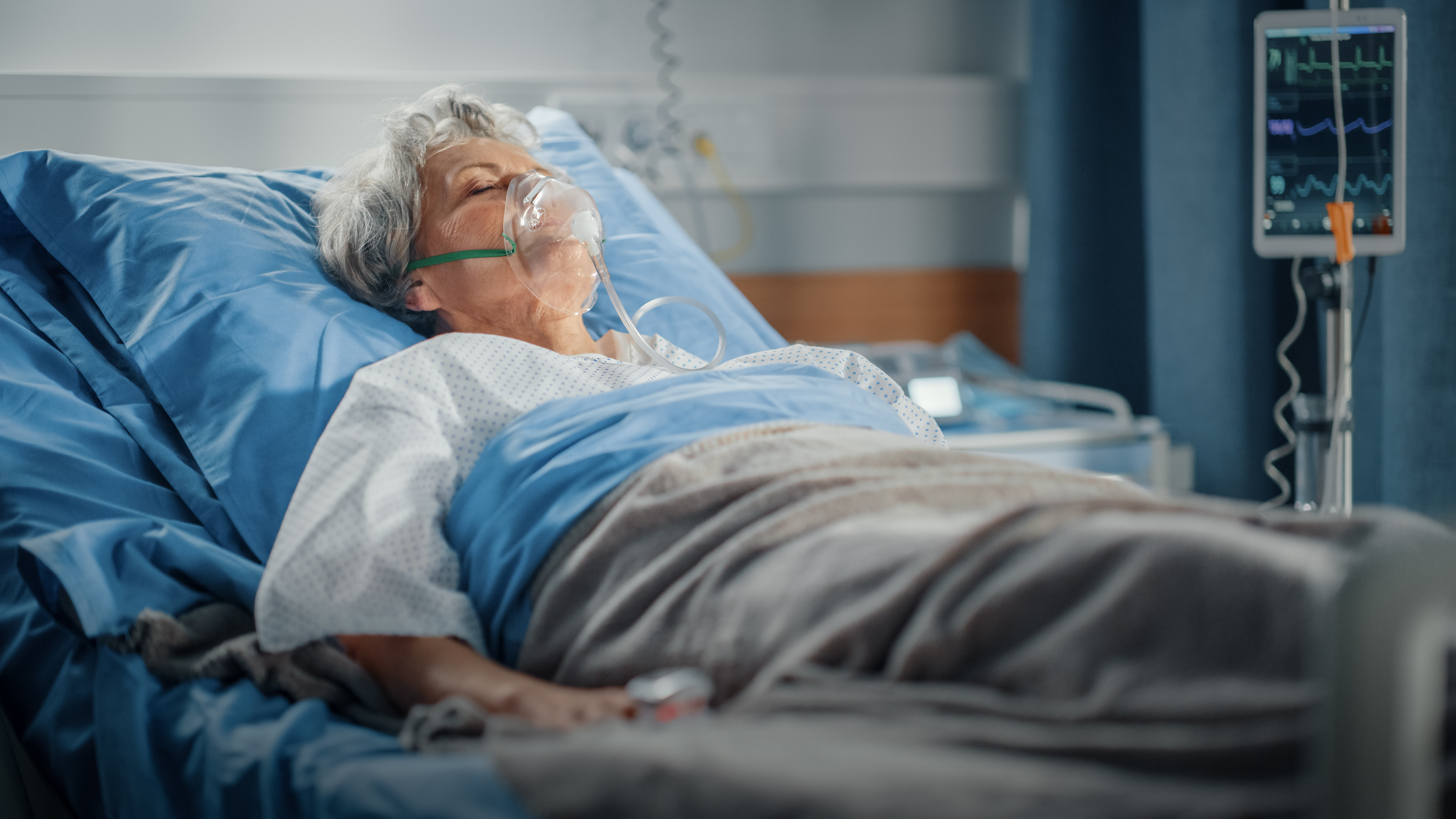 Elderly Woman in Hospital Bed | Source: Shutterstock