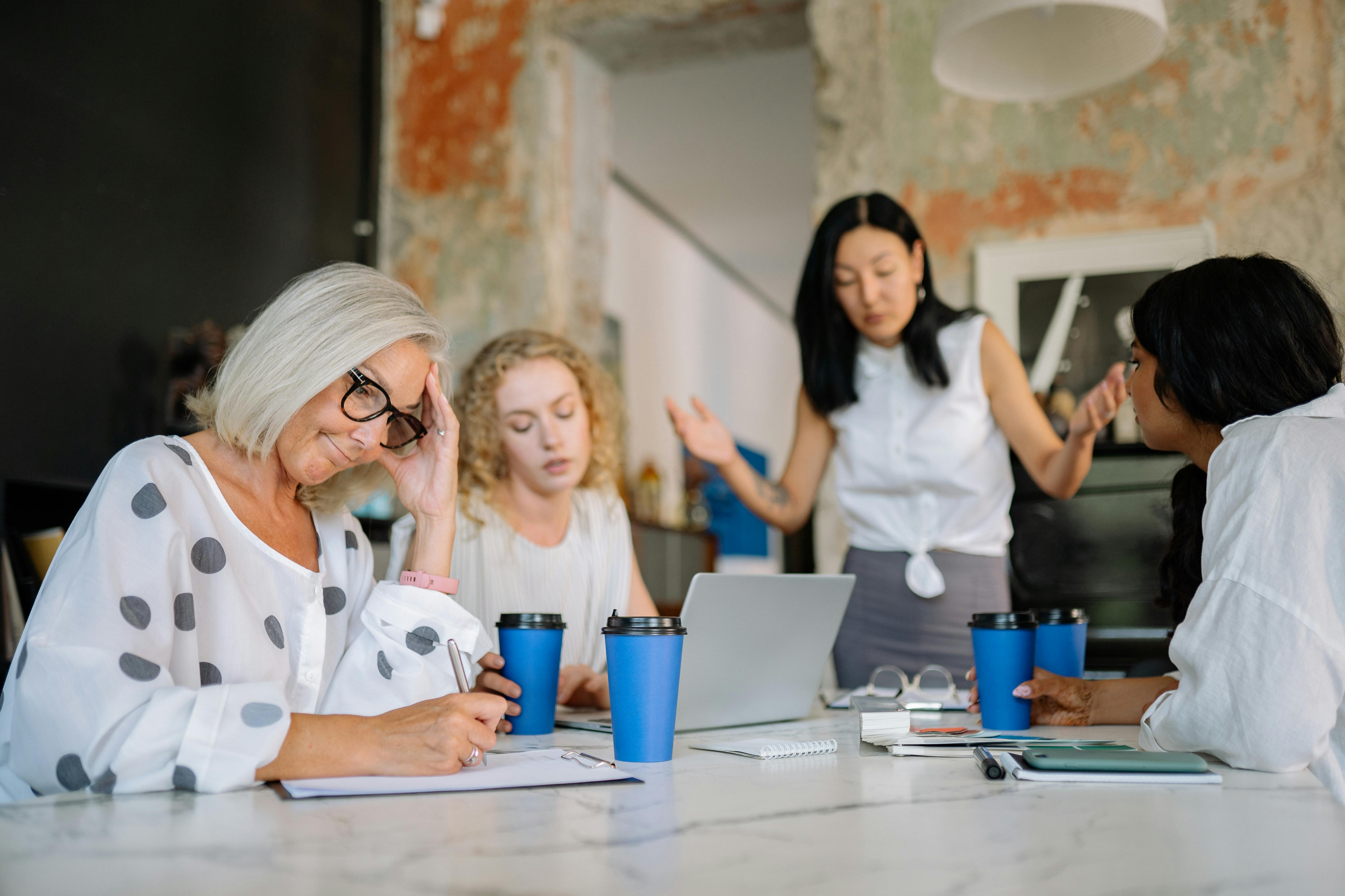 A group gathered around a table | Source: Pexels