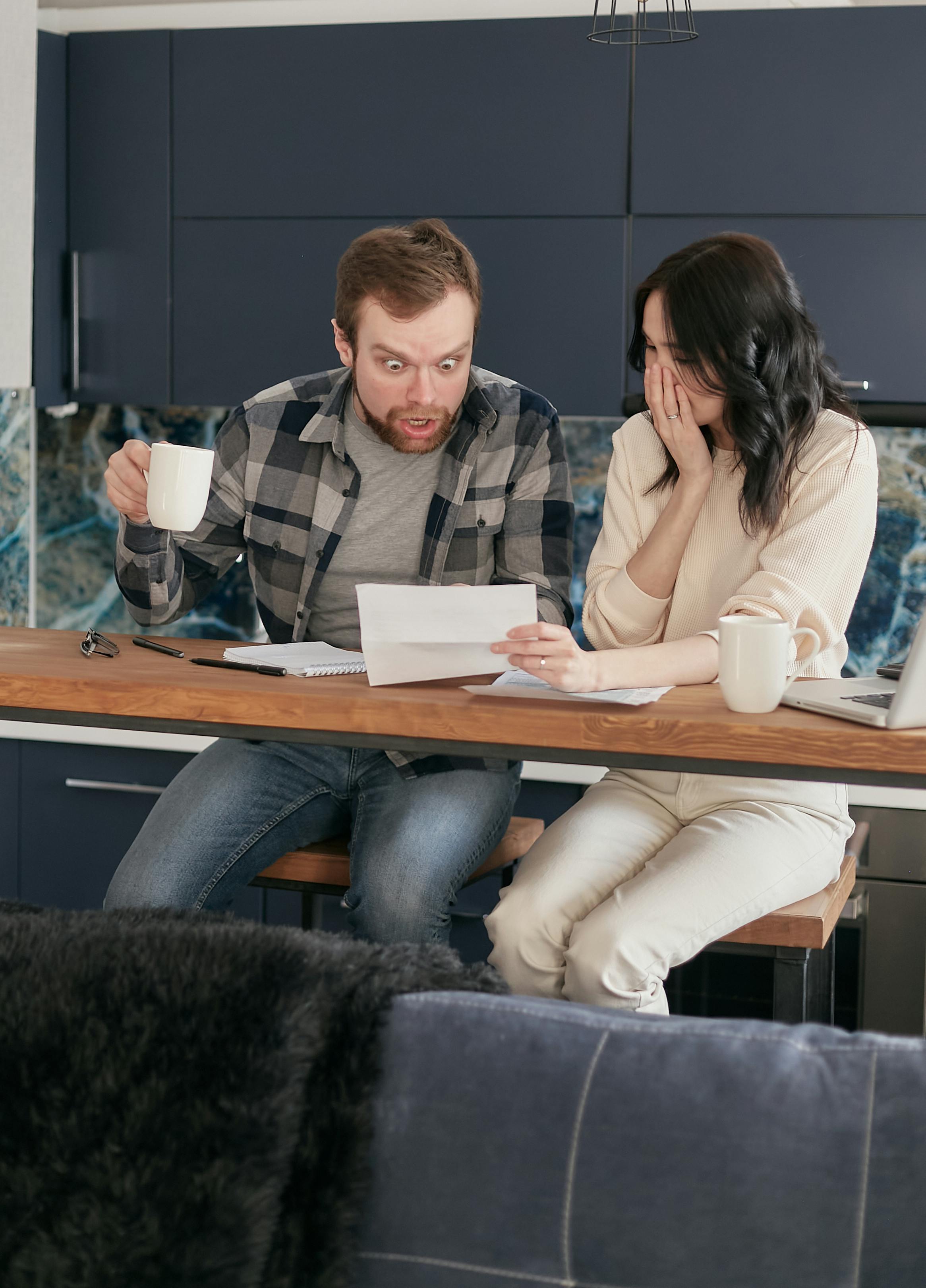 A man and woman perusing through some papers | Source: Pexels