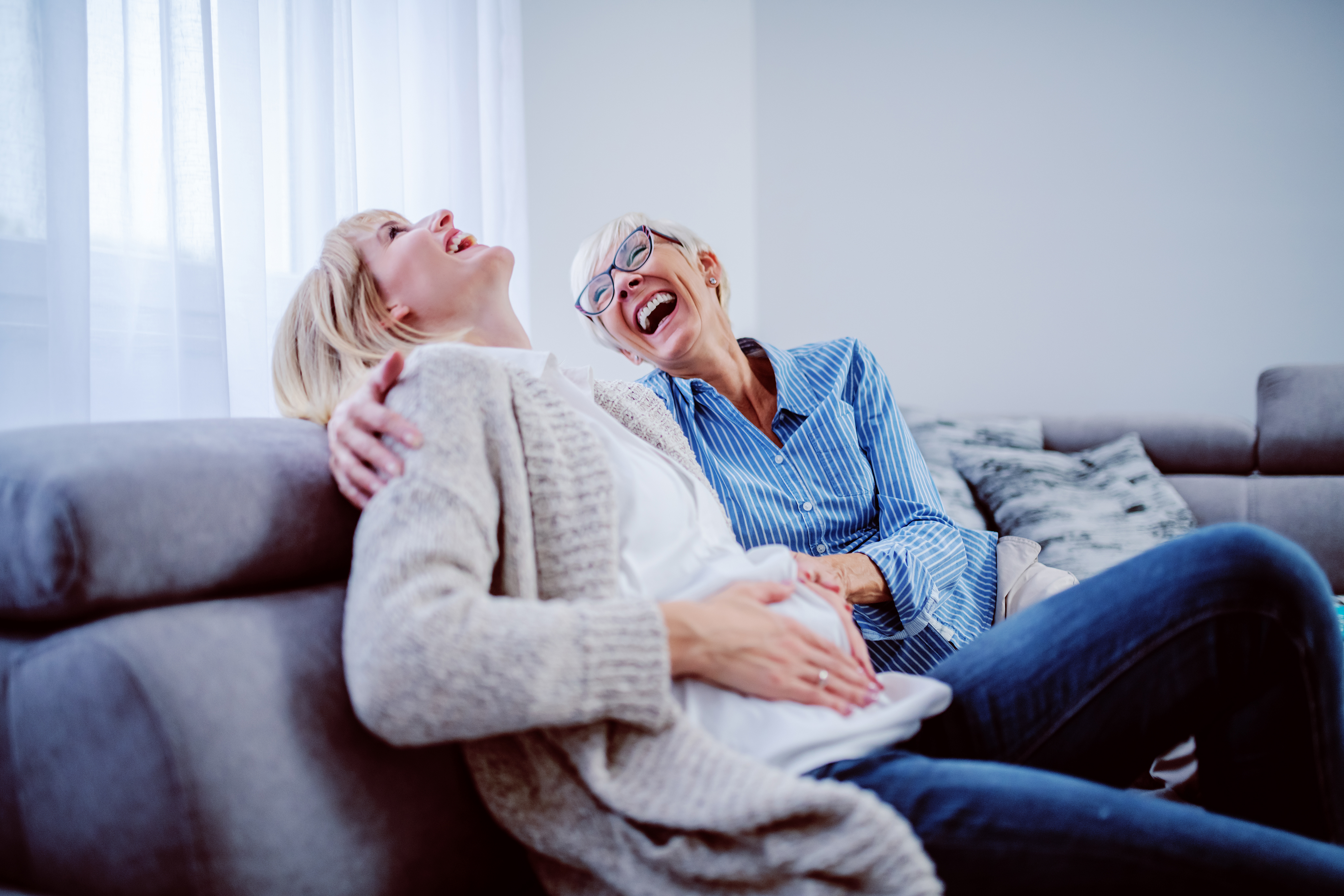 A younger woman and an older one happy about a pregnancy | Source: Shutterstock