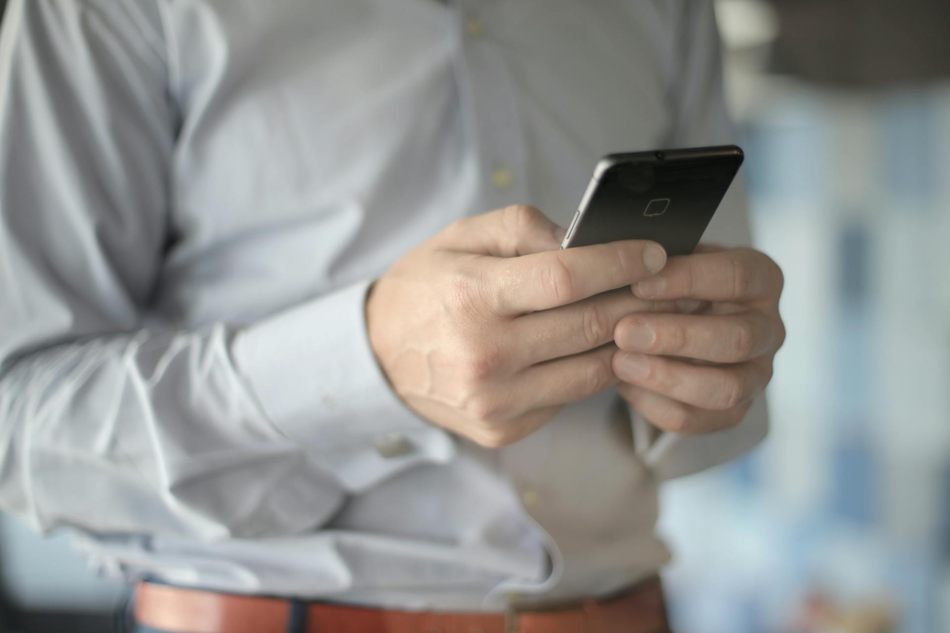 A man using his phone | Source: Pexels